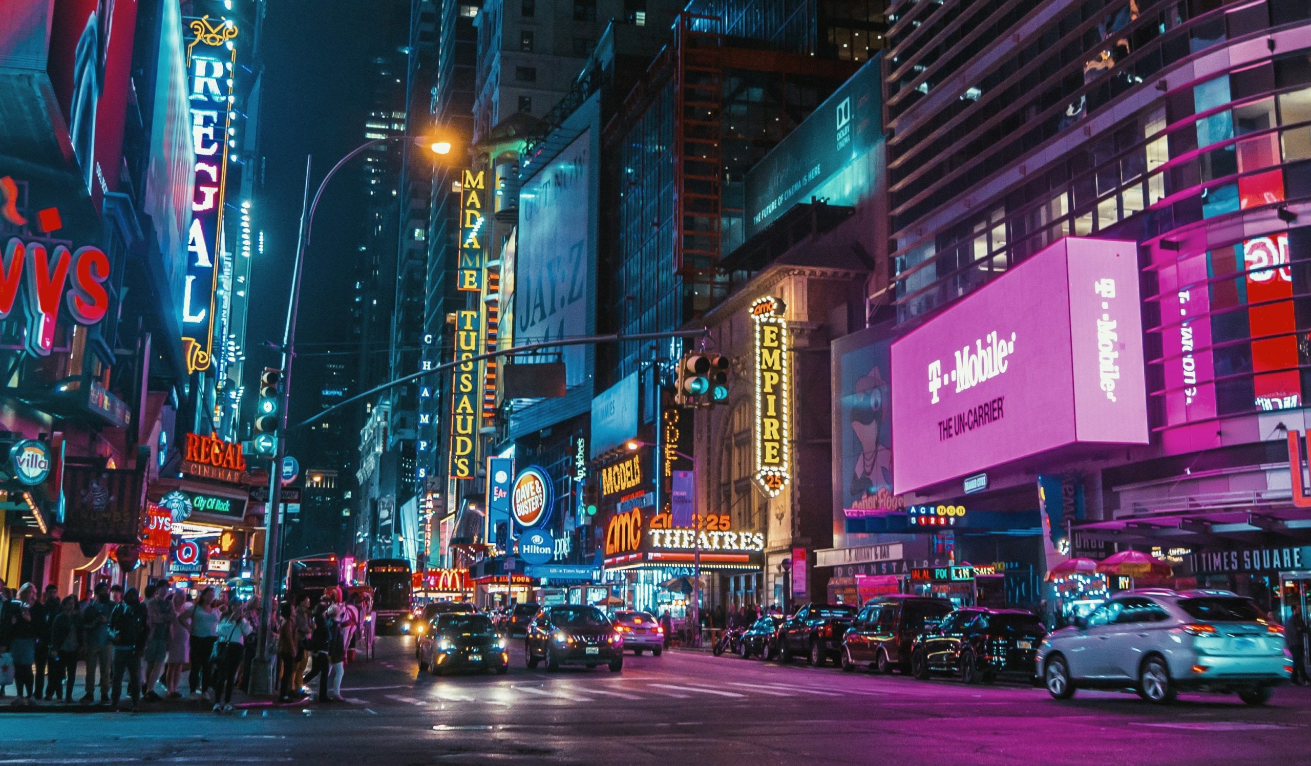 Brands and logos displayed in a city nightscape.