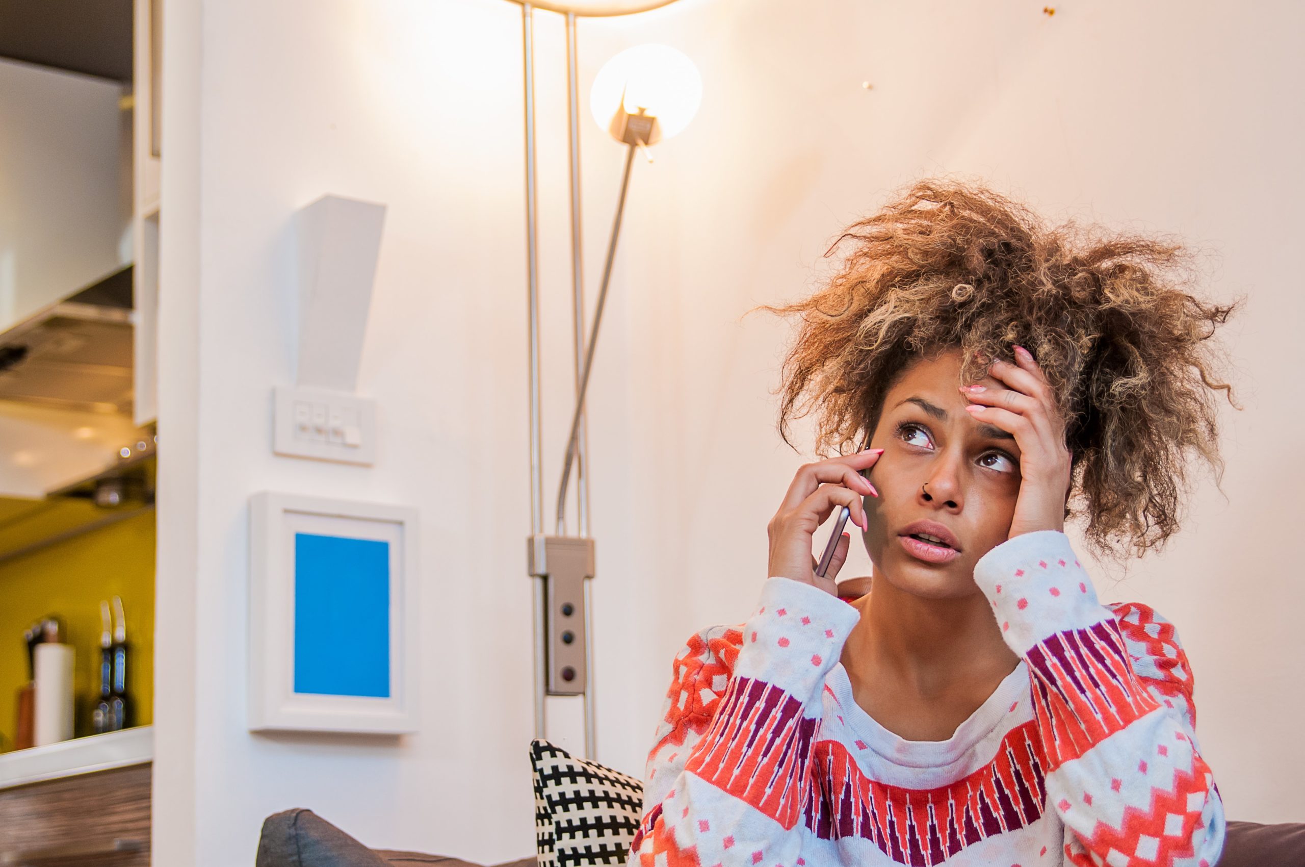 Woman receiving a nuisance phone call.