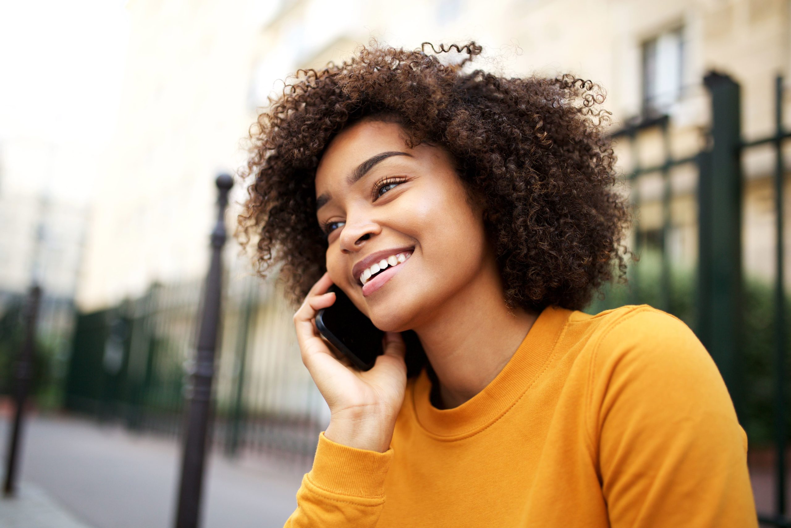 University graduate on phone.